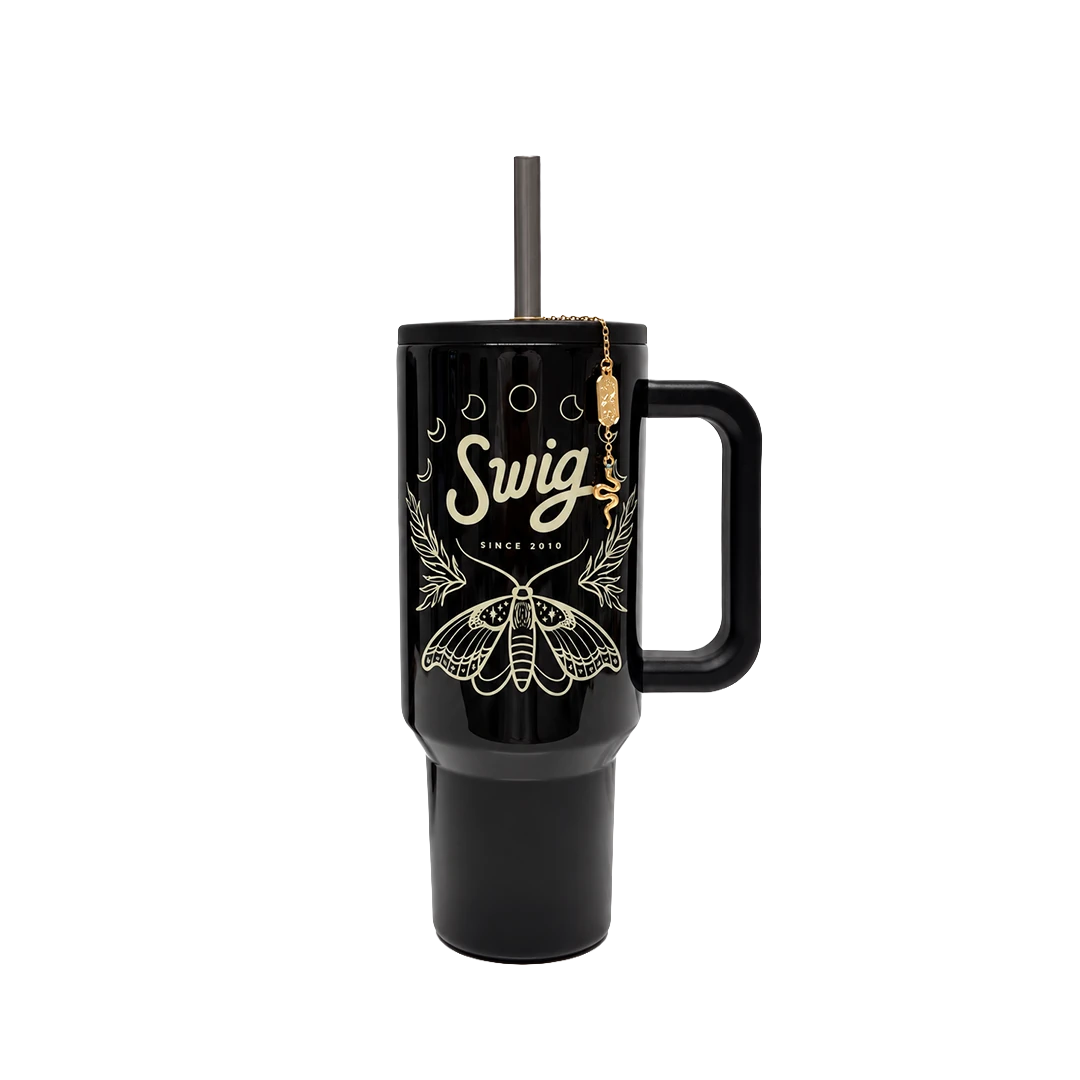 Witching Hour tumbler transitioning from daylight to its glow in the dark design.